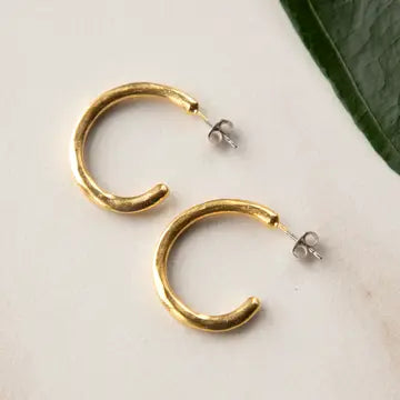 Stowaway Imani hand-sculpted hoop post earrings with intricate textured jewelry design, featuring a modern, artistic style.