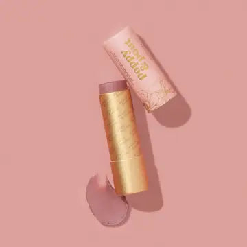 All natural lip tint by Poppy & Pout showing a close-up of the tinted lips with a soft, natural color.