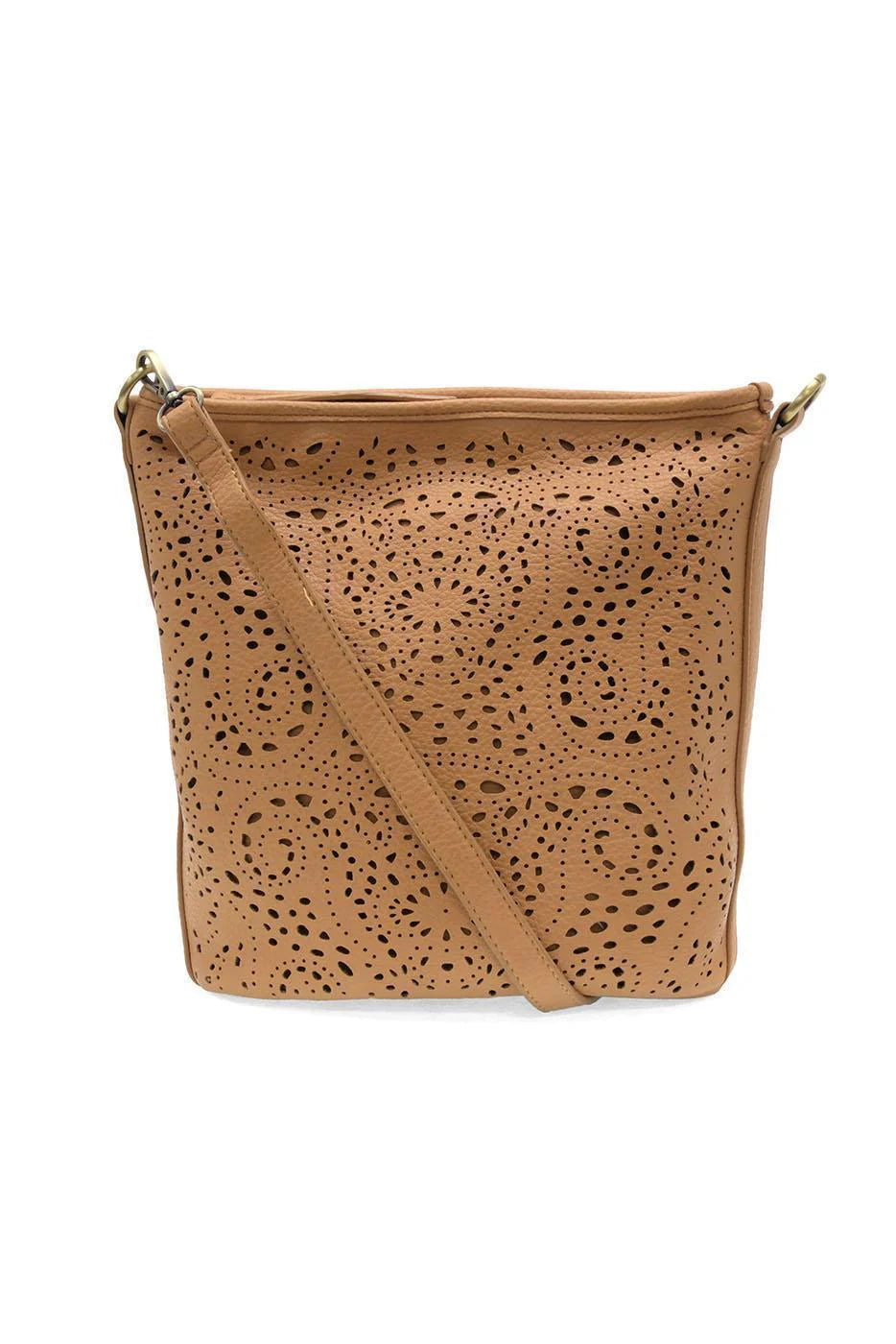Tan lazer cut eyelet bucket crossbody purse by JoySusan featuring a stylish, compact design with eyelet accents.