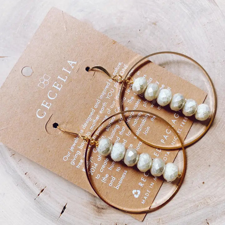Gold plated drop hoop earring with colorful gemstone accents from Cecelia Designs Jewelry, showcasing intricate jewelry craftsmanship.