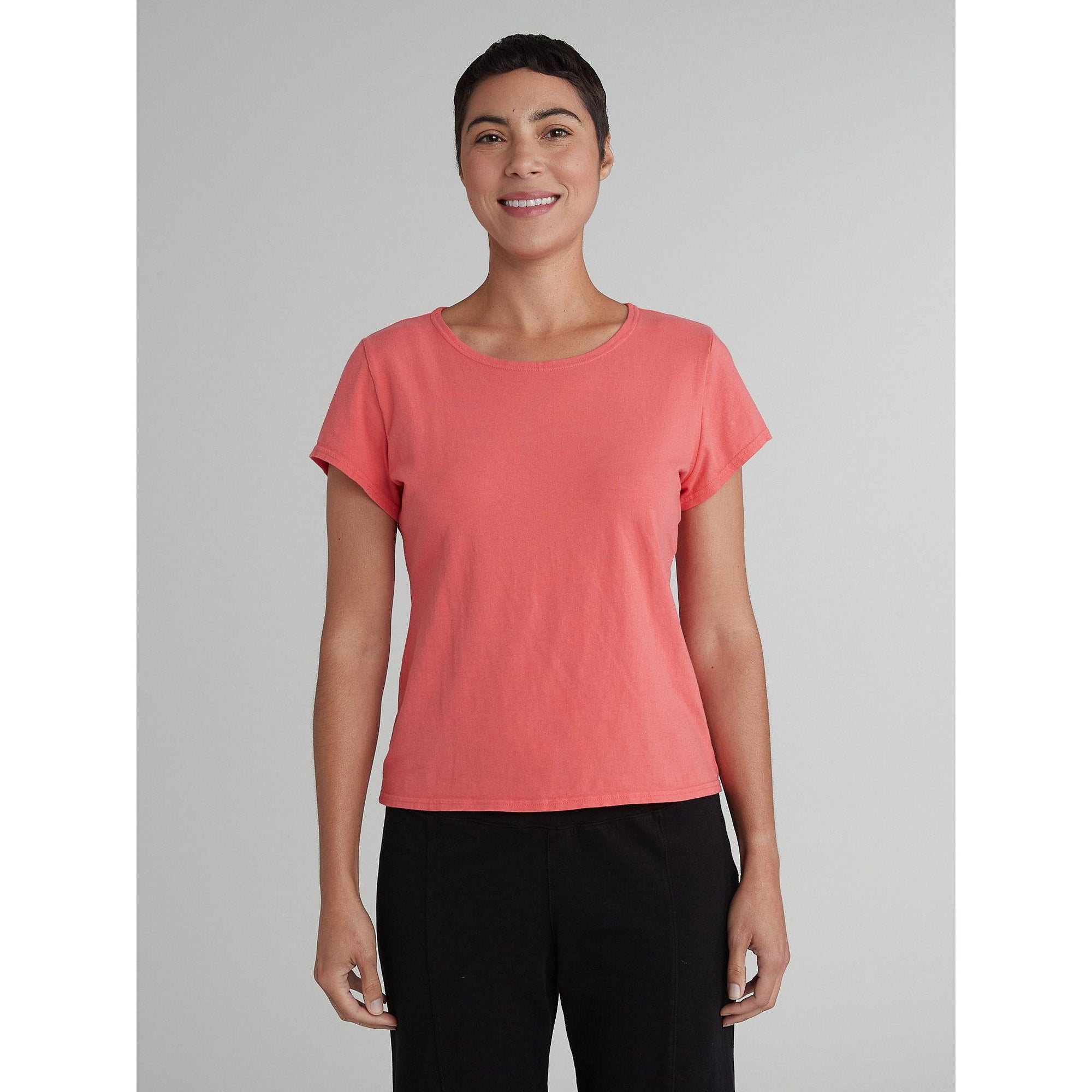 Red short sleeve fitted Lycra top by Cutloose, showcasing a close-up of the stretchy, form-fitting fabric.