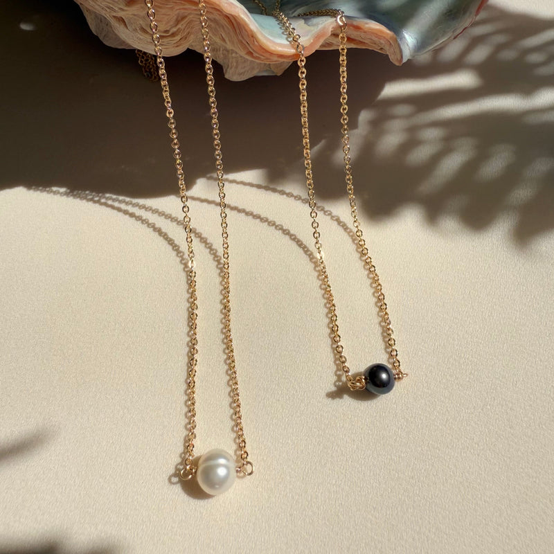 In Situ Aliso gold fill necklace with white pearl, 18-inch jewelry showcasing elegant, minimalist design with a shiny finish.