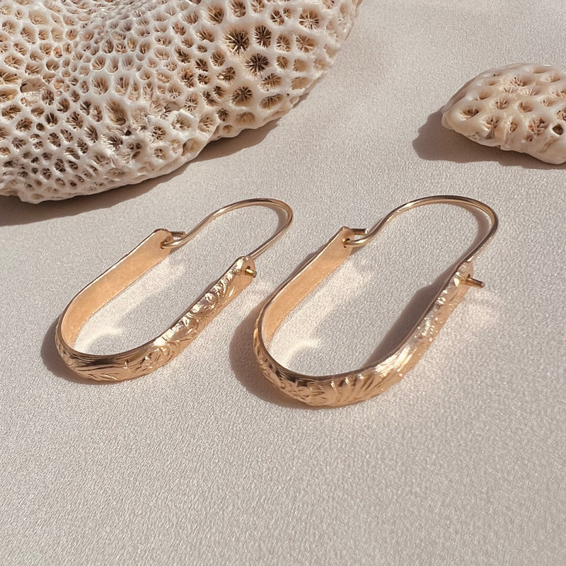 In Situ Lehua Floral gold-filled earrings featuring delicate floral design and intricate detailing.