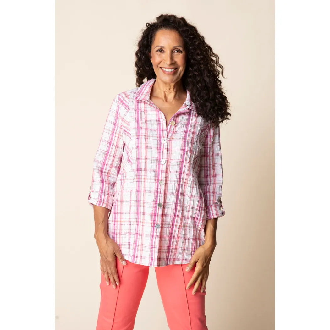 Blurred coral plaid tunic by Habitat, featuring a relaxed fit and stylish pattern, shown hanging on a white background.