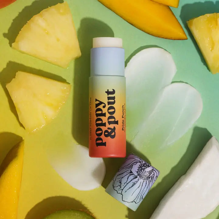 Poppy & Pout 100% natural lip balm in a sleek tube, showing soft, smooth lips with a subtle shine and natural color.