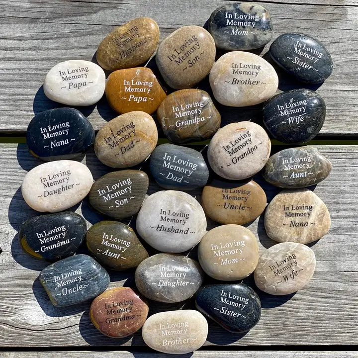In Loving Memory River Rock Assort by SHOPGIVECOURAGE featuring smooth, engraved memorial river rocks in various shapes and sizes.