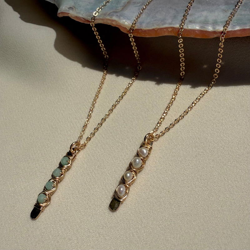 In Situ Malia gold fill necklace featuring a white pearl pendant on an 18-inch chain, elegant jewelry accessory.
