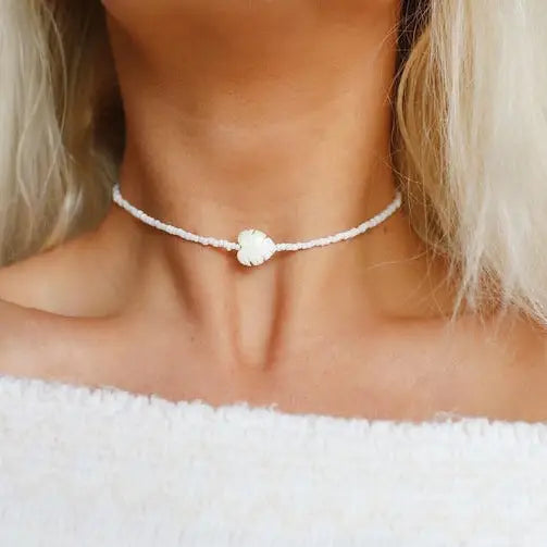 Tropical palm leaf beaded choker necklace by Bohemians Closet featuring natural beads and vibrant leaf accents.