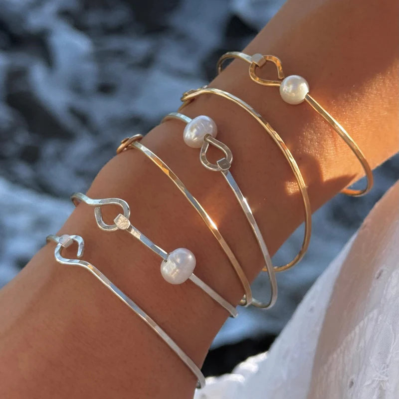 In Situ Avalon Pearl Bracelet GF showcasing elegant white pearls and silver-toned jewelry design on a delicate bracelet.