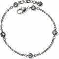 Brighton Twinkle Anklet featuring delicate chain with sparkling star charms, worn on a model's ankle for a stylish look.