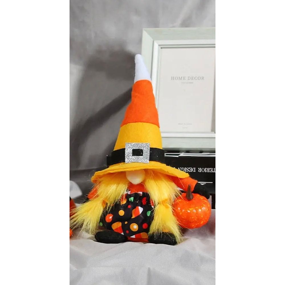 Fall Halloween gnome by Ornamentally You with black, orange, and yellow striped clothing, perfect for Halloween decor.