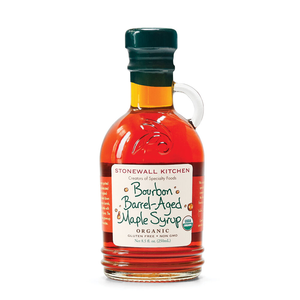 Organic Bourbon Barrel Aged Maple Syrup by Stonewall Kitchen, dark amber syrup in a glass bottle with a wooden cork.