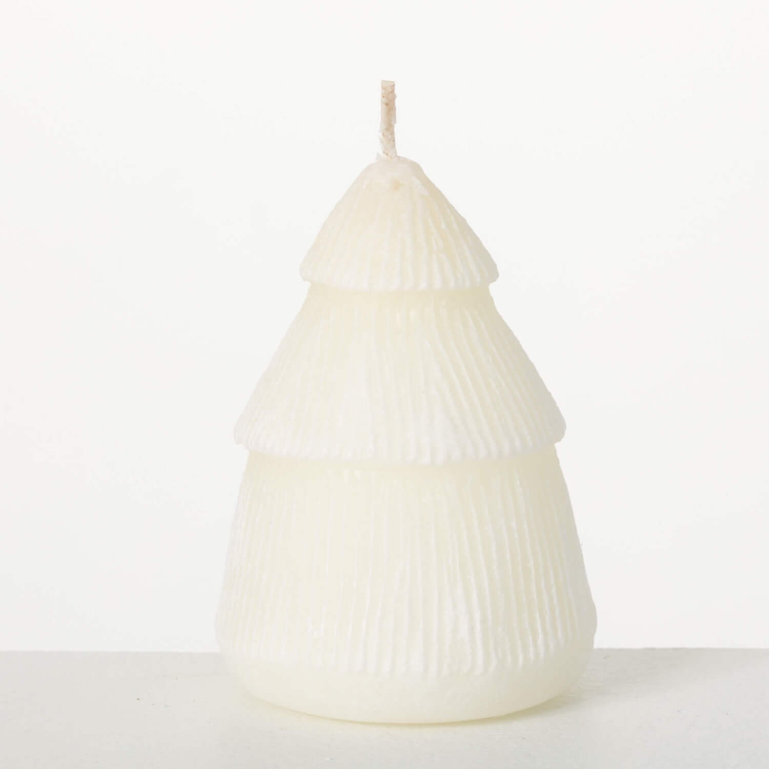Sullivans white Christmas tree candle, 3-inch tall, with detailed holiday tree design and textured surface.