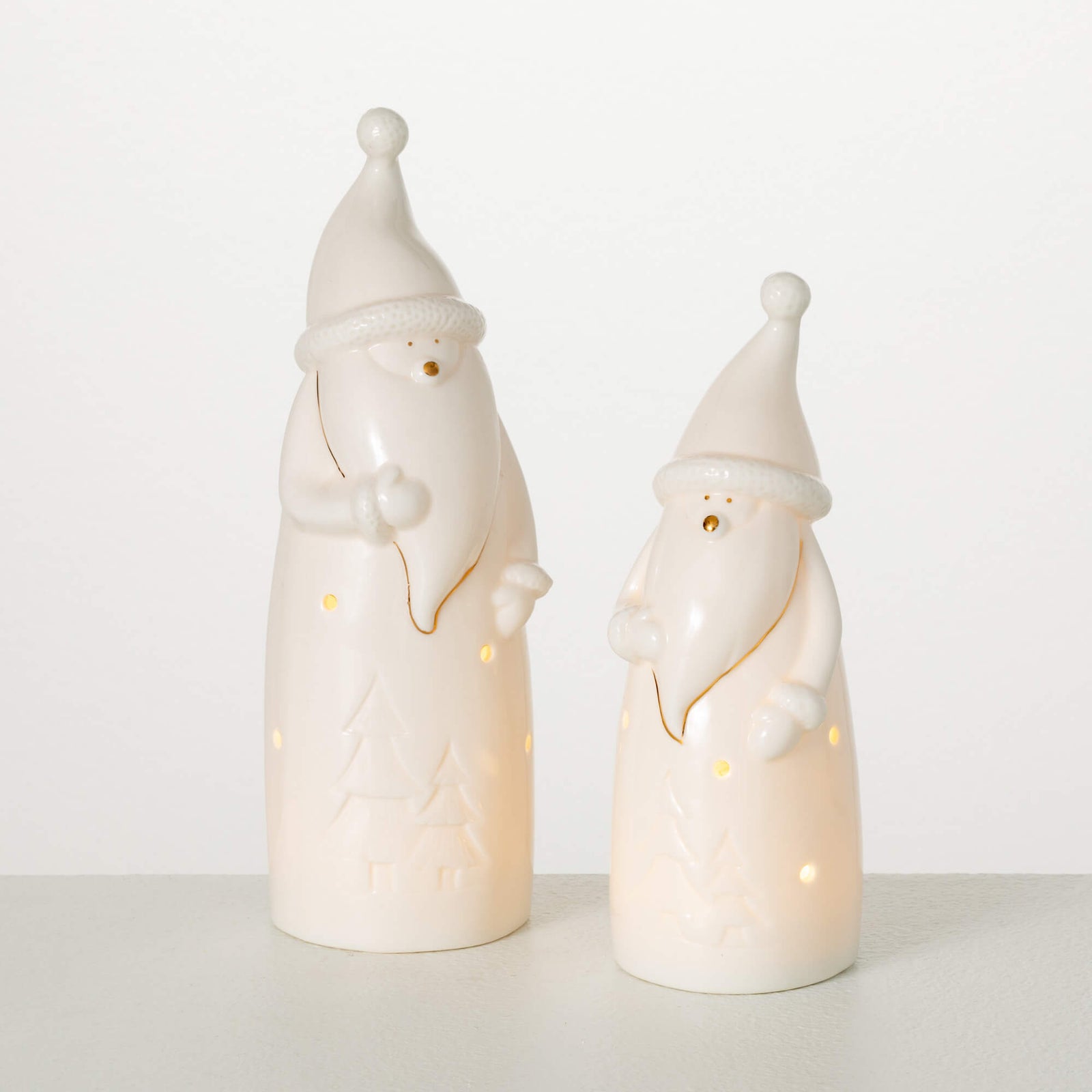 Sullivans LED Santa Gnome figurine made of porcelain with a gold finish, featuring festive holiday decoration details.