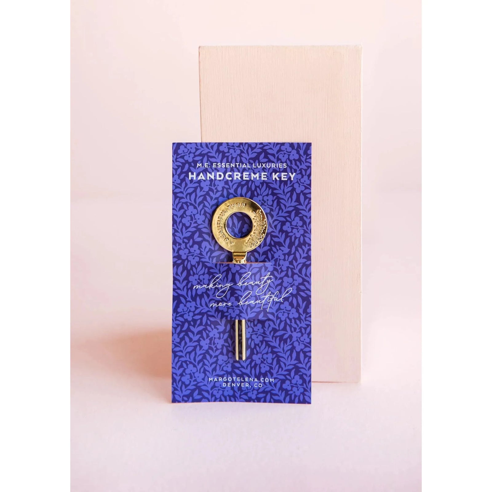 The Cottage Greenhouse Margot Elena Hand Creme Key in a luxurious lotion container, designed for moisturizing hands.
