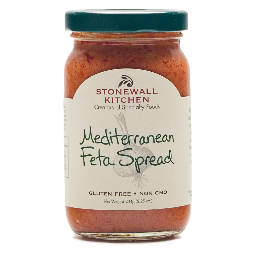 Creamy Mediterranean Feta Spread by Stonewall Kitchen in a jar, with herbs and crumbled feta visible.